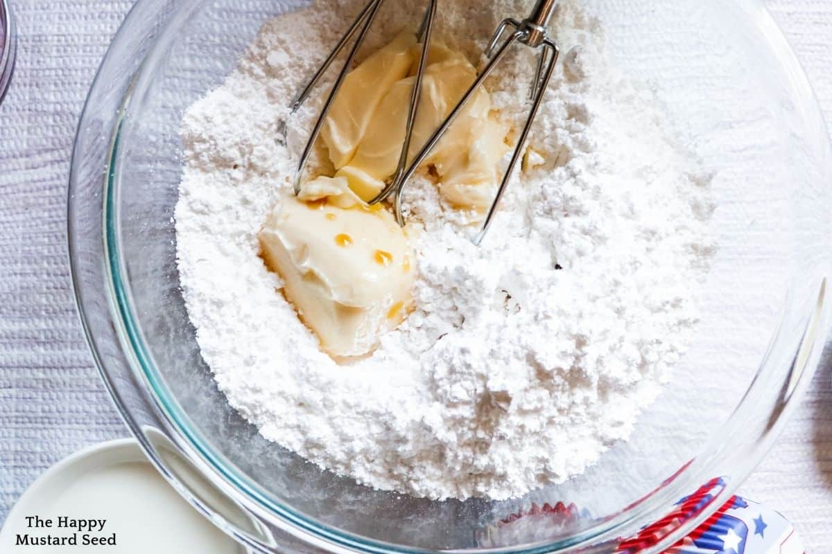 top view of powdered sugar with vanilla and softened butter