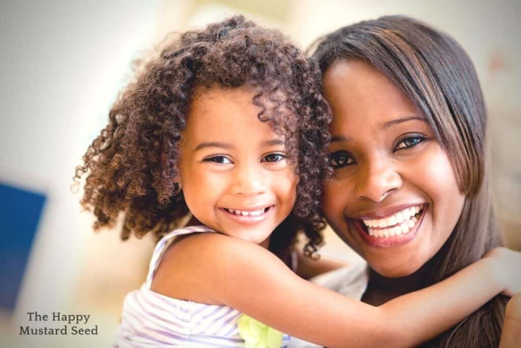 Happy stay at hoeme mom smiling with daughter