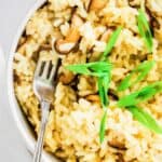 Top-view-of-Instant-Pot-musroom-risotto-in-white-bowl-with-garnish