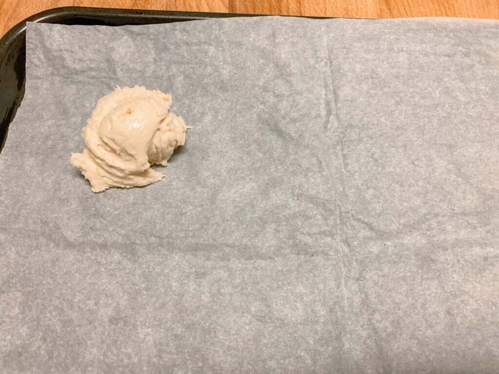 Dollop-of-sourdough-lemon-cookies-dough-on-parchment-paper