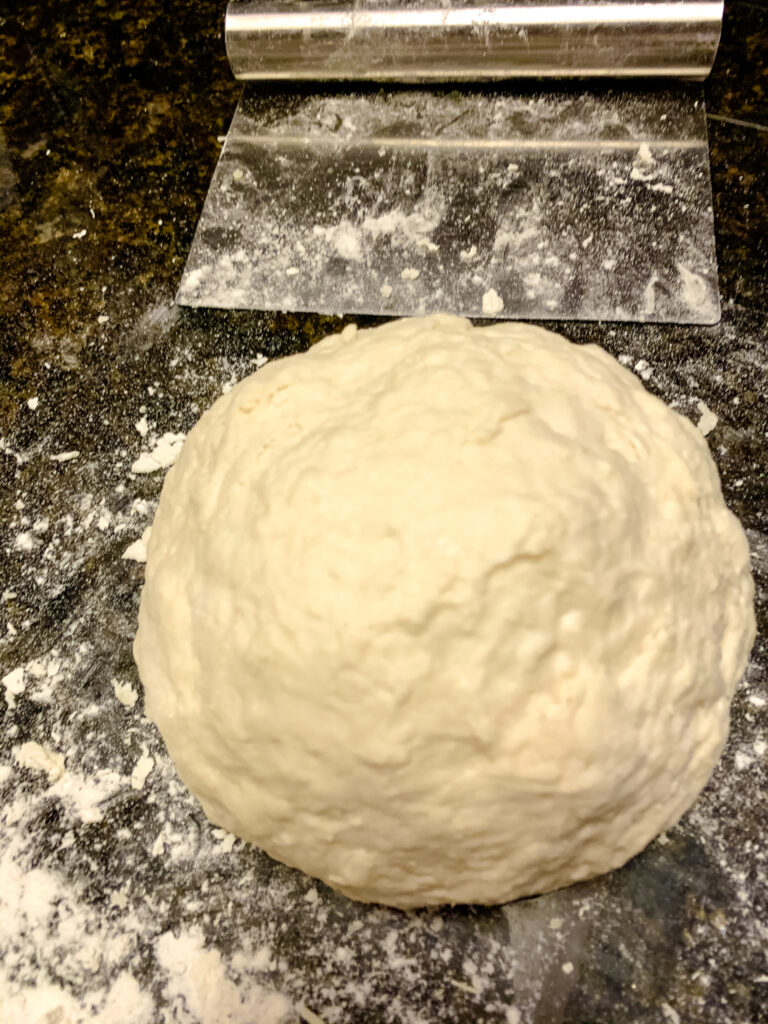 sourdough ball ready to go into crock pot slow cooker bread dough