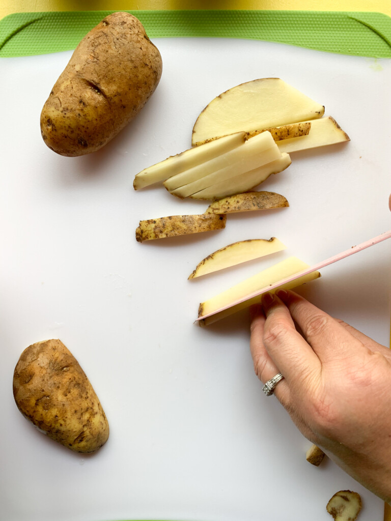 slicing potatoes for carne asada fries