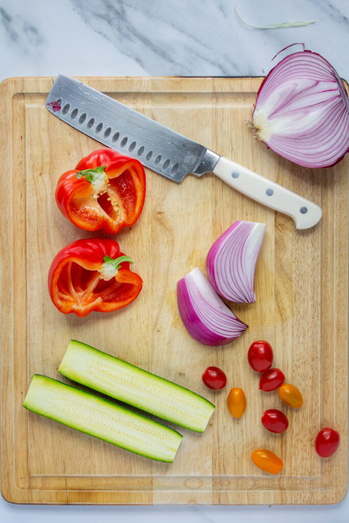 slicing vegetables on cutting board