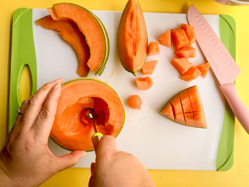 How-To-Cut-A-Cantaloupe-melon-ball-first-scoop