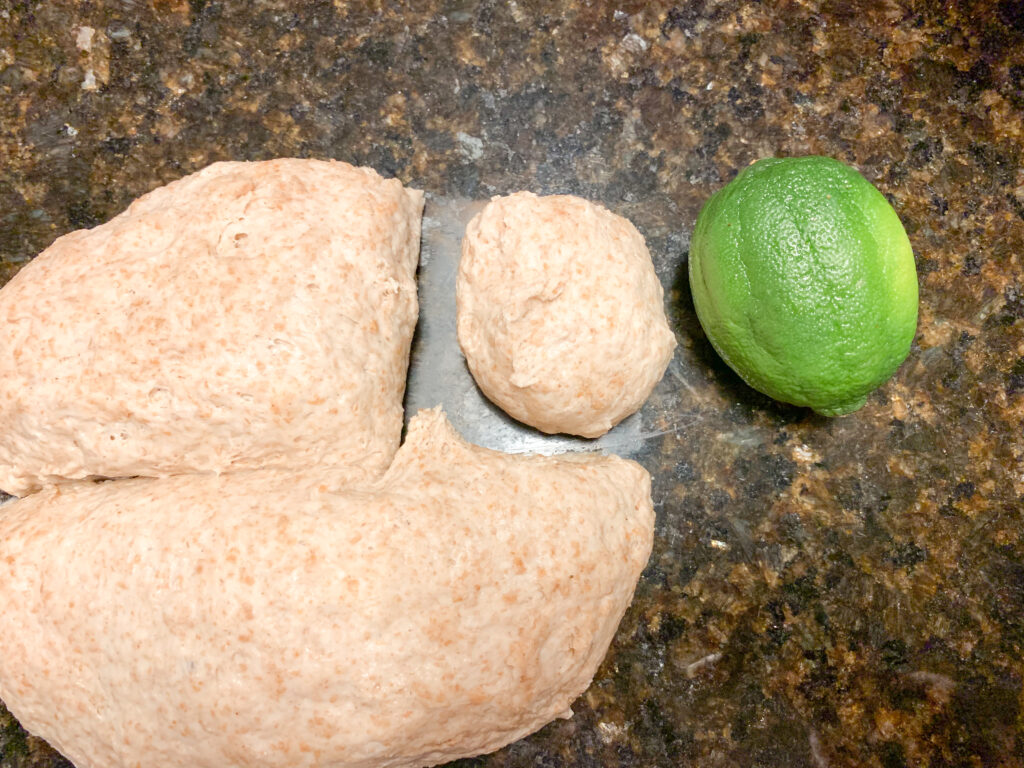 same day pita pockets dough on surface with lime