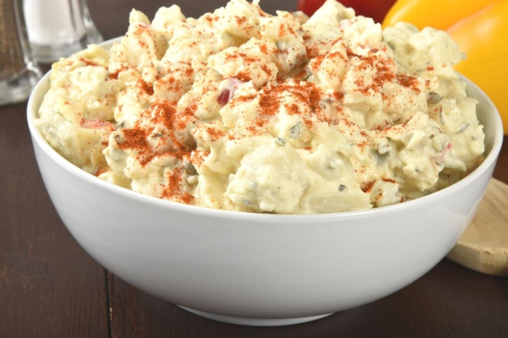 potato salad in bowl with paprika 