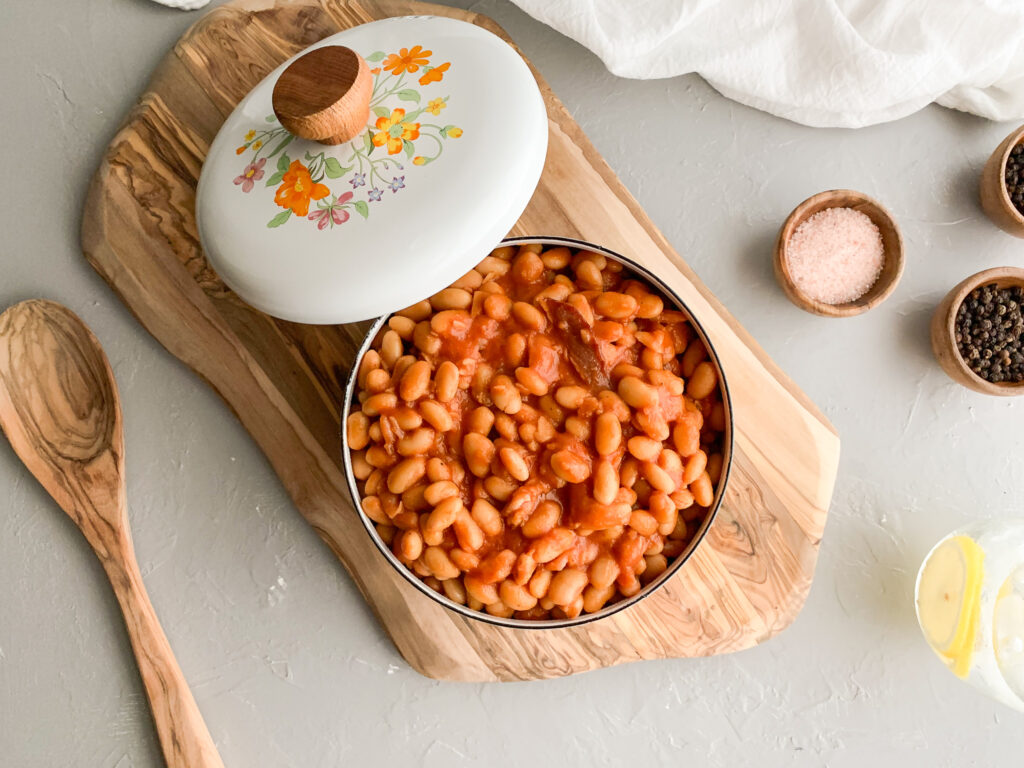 Pork-And-Beans-in-pan-next-to-wooden-spoon