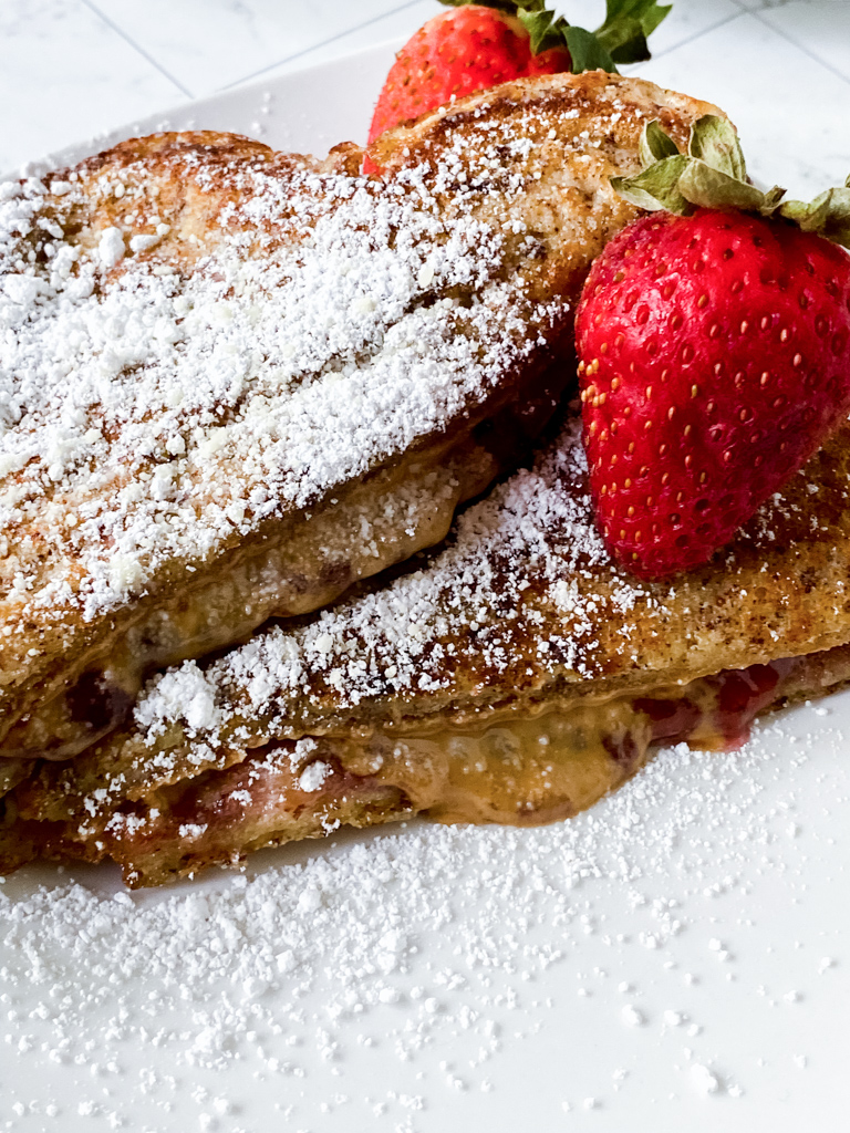 Double-Dip-French-Toast-Recipe on white plate with sugar