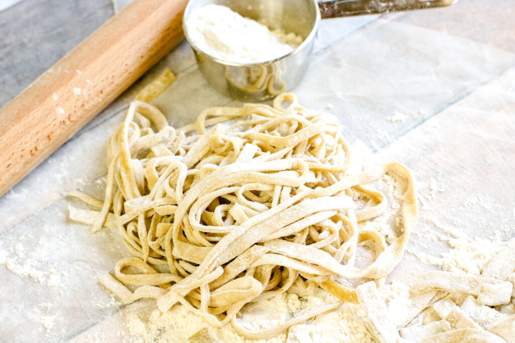 homemade pasta without machine on floured surface
