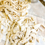 homemade pasta made without a machine on floured surface