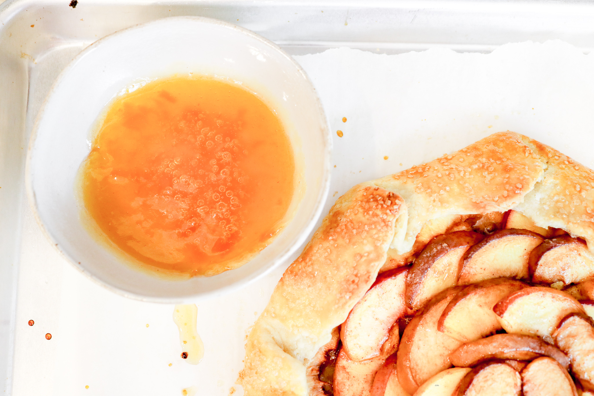 peach glaze in bowl with sourdough galette