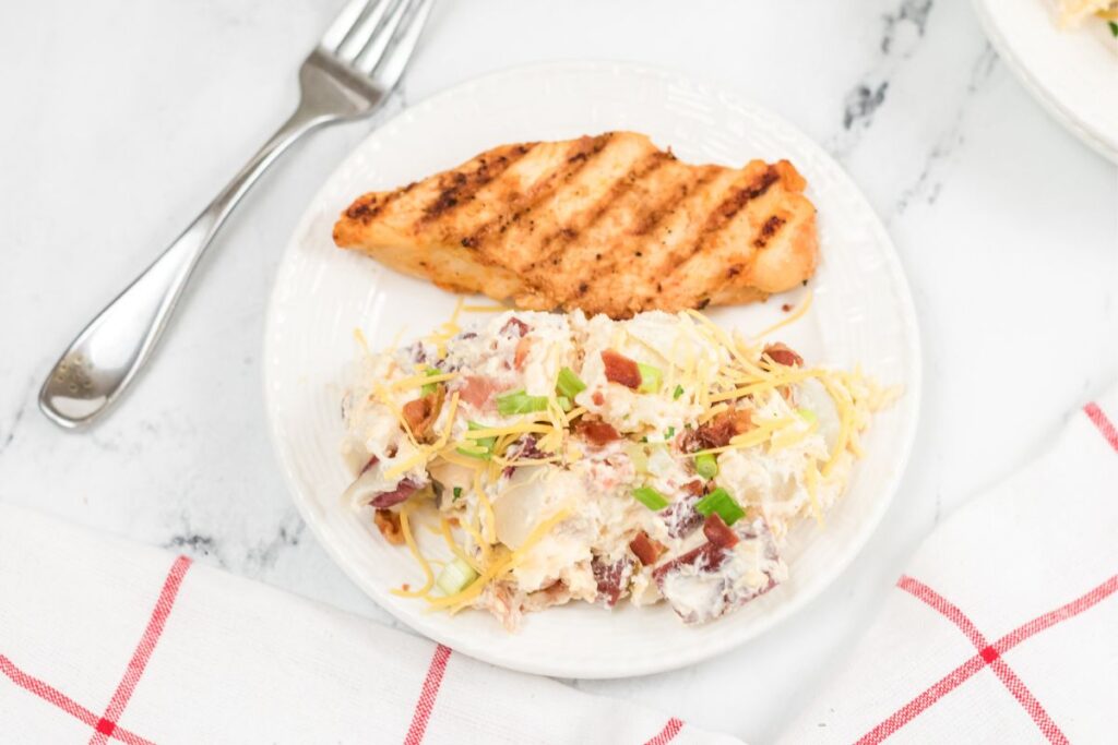 steakhouse potato salad with chicken on a plate.