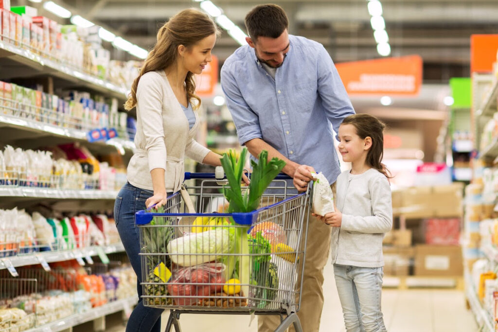 Meal planning for kids - family at grocery store with shopping cart